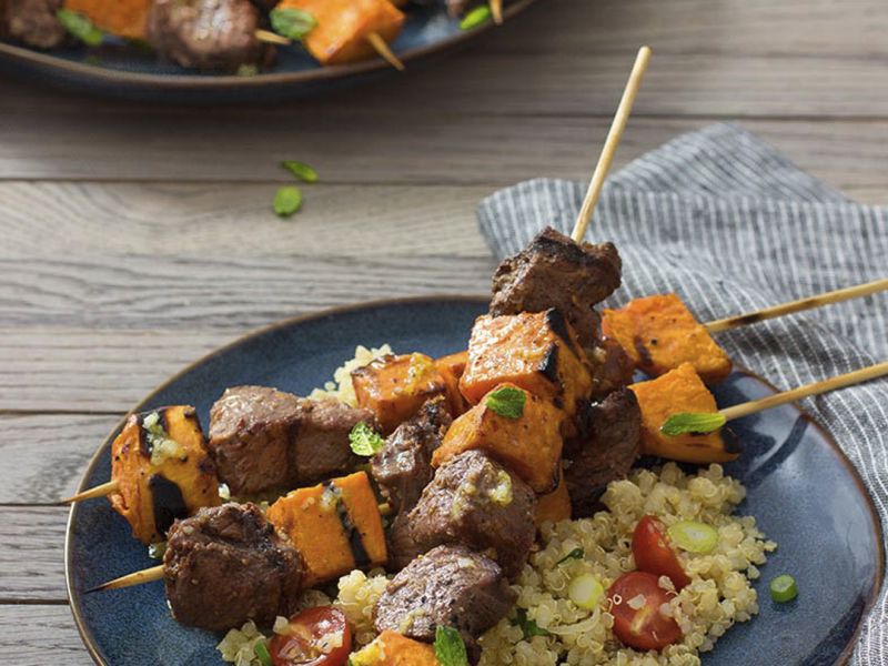  Grilled Lamb and Sweet Potato Kabobs with Quinoa, Garlic, Lemon, and Mint